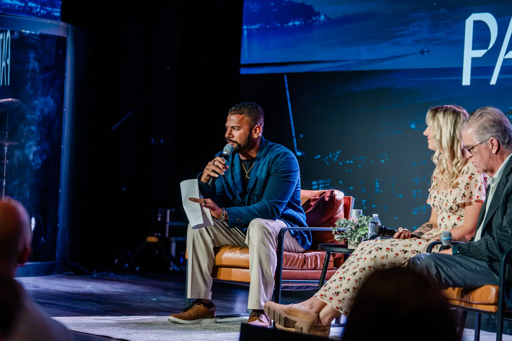 Jason Godinho in conversation with fellow panelists at an EMRG event.